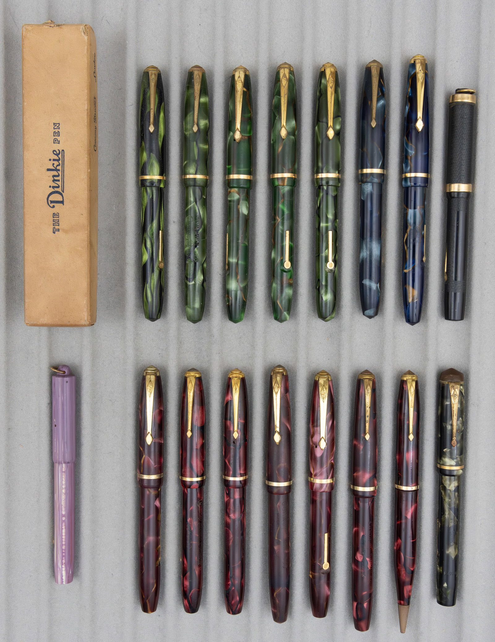 Conway Stewart Dinkie Fountain Pen and Pencils (17): Conway Stewart Dinkie fountain pens and pencils (17). Assorted Dinkie pens along with one original box. 16 fountain pens with 14K nibs and one pencil. Overall good condition.