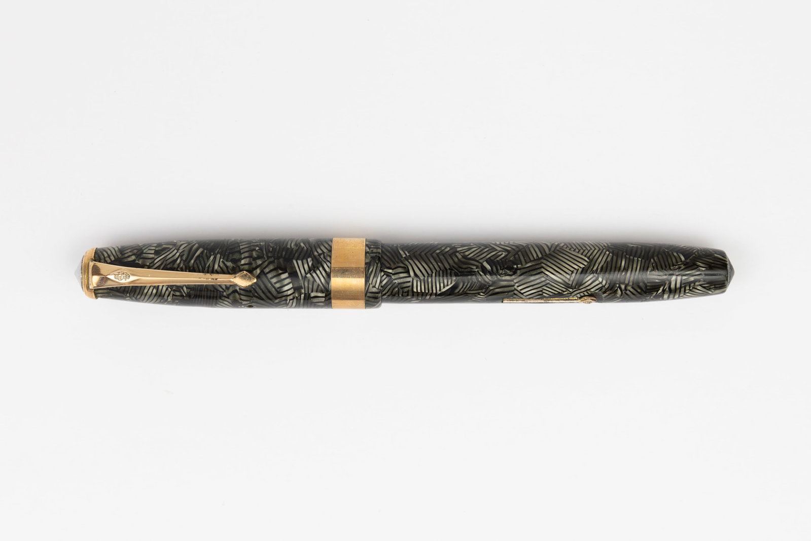 Conway Stewart 58 Grey Hatched Fountain Pen: Conway Stewart 58 Grey Hatched fountain pen, circa 1950’s. Grey Hatched pattern with gold filled trim and medium Conway Stewart 14K nib. Length 5 1/8 inches and 6 1/4 inches posted, filling