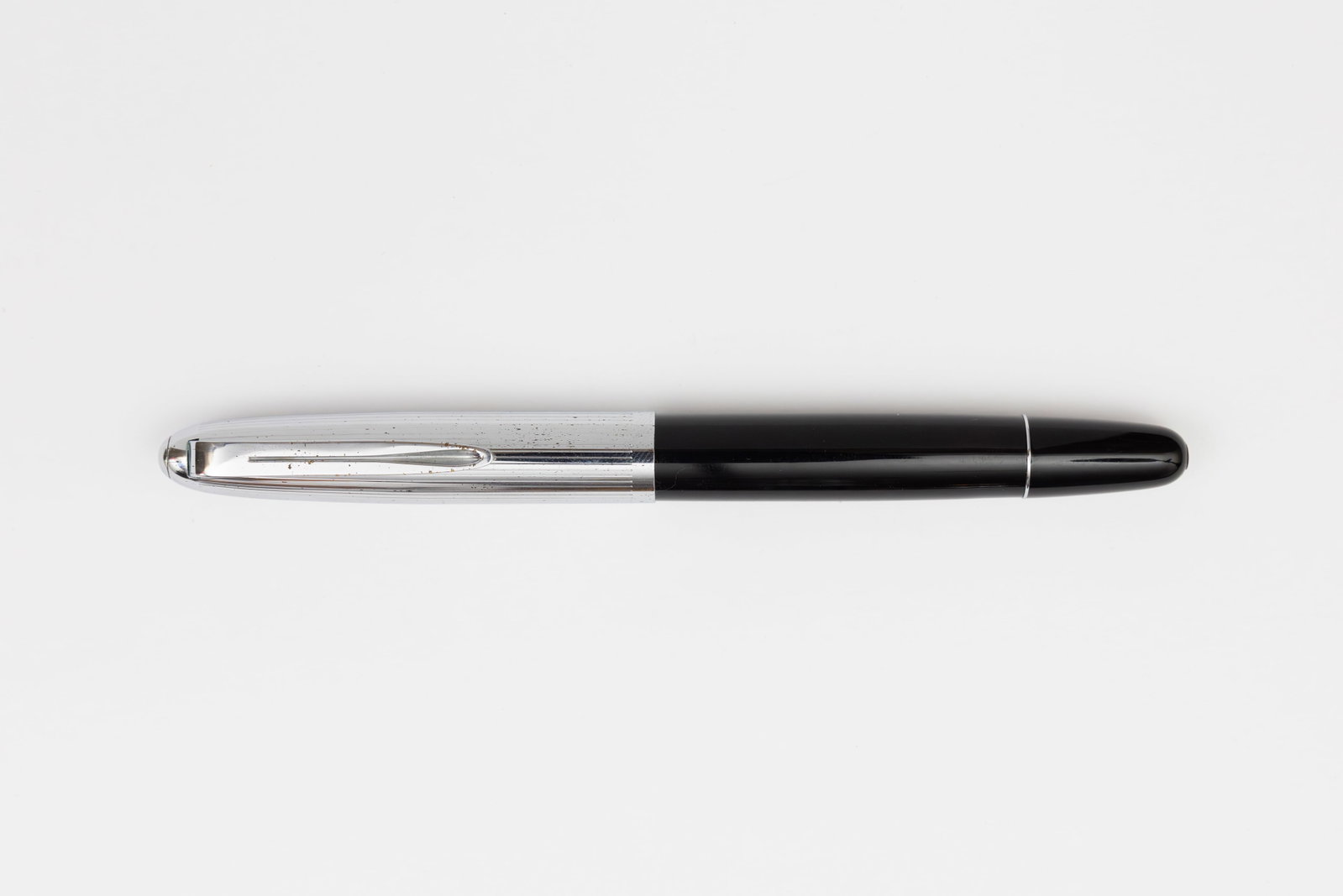 Aurora 88K Celluloid Fountain Pen, Flexible Nib: Aurora 88K fountain pen, circa 1950’s. Aurora 88K in black with silver plated cap and fine flexible 14K nib. Length 5 3/8 inches and 5 3/4 inches posted, filling mechanism piston fill. Overall g