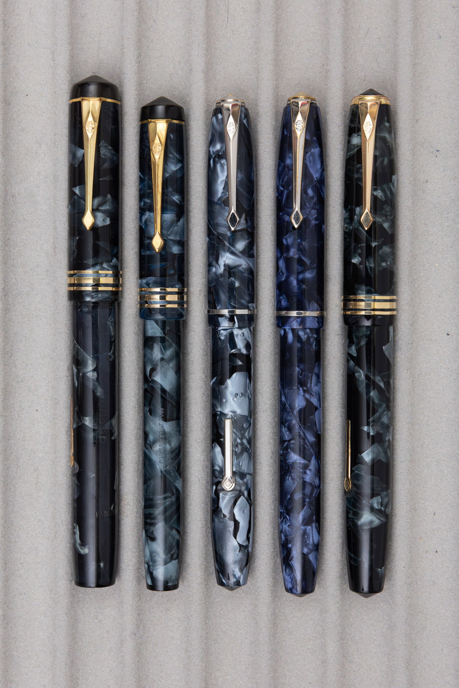 Conway Stewart Blue Marbleized Celluloid Fountain Pens (5): Conway Stewart blue marble fountain pens (5). Conway Stewart 55, 58, 75 (2) and 388 fountain pens with 14K Conway nibs (all flexible). Overall good condition, some brassing present and wear to