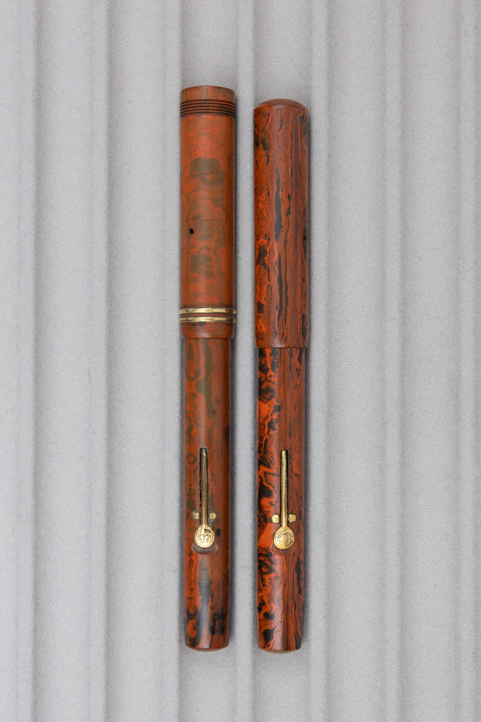 Conway Stewart 210 and 470 Red Mottled Fountain Pens: Conway Stewart 210 and 470 mottled hard rubber fountain pens. Clipless, both with lolly pop style levers and 14K Conway Stewart nibs. Length 5 1/4-5 3/8 inches, filling mechanism lever fill. Overall
