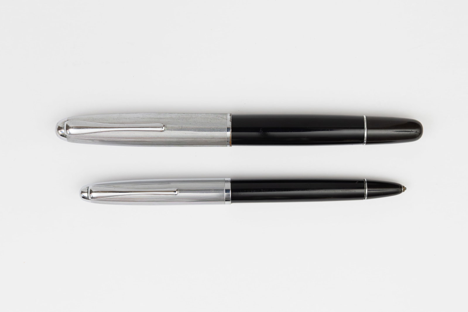 Aurora 88 Silver Cap Fountain Pen and Pencil Set, Flexible Nib: Aurora 88 fountain pen and pencil set, circa 1950’s. Aurora 88 Italian made hooded nib fountain pen in celluloid with silver plated cap and matching cap actuated mechanical pencil. Marked Aurora