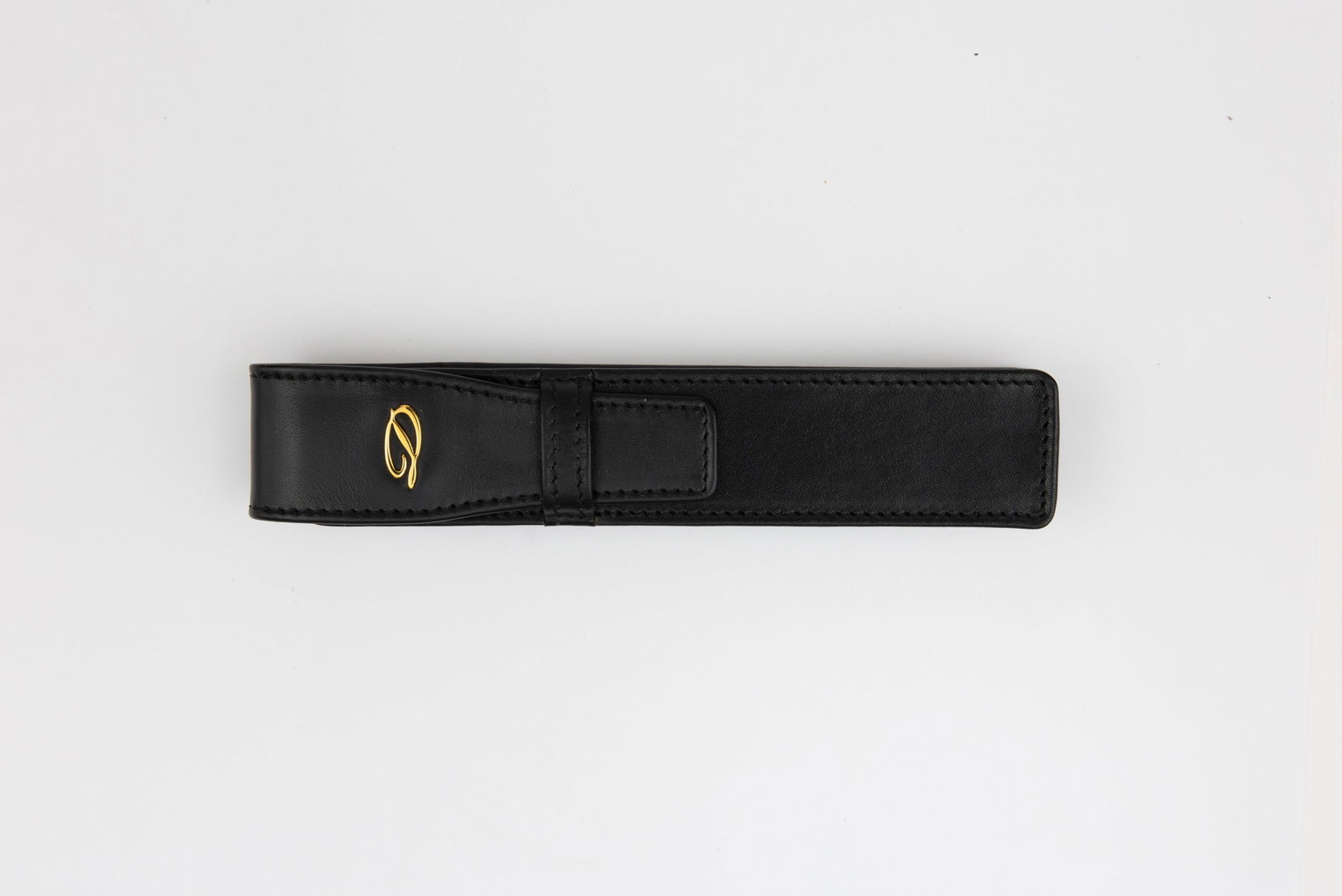 ST Dupont Leather Pen Case, Raised Design, Boxed: S.T. Dupont leather pen case with raised design, boxed. Black leather with raised metal D logo on flap, marked S.T. Dupont Paris under flap. Length 5 7/8 inches by 1 1/8 inches. Overall near mint