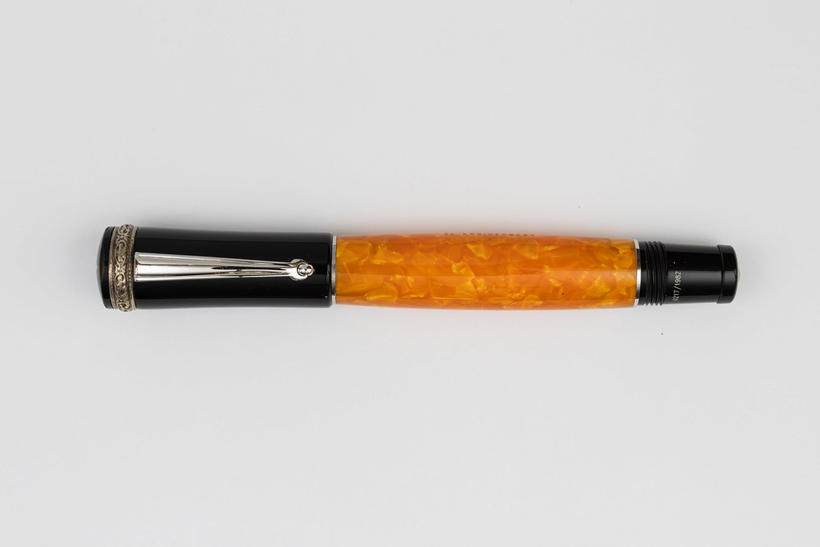 Delta 20th Anniversary LE Fountain Pen, Boxed: Delta 20th Anniversary limited edition fountain pen with box, outer box and papers, circa 2002. Limited to 1,982 pieces (0217/1,982) with yellow marble barrel, roller clip and sterling silver upper ca