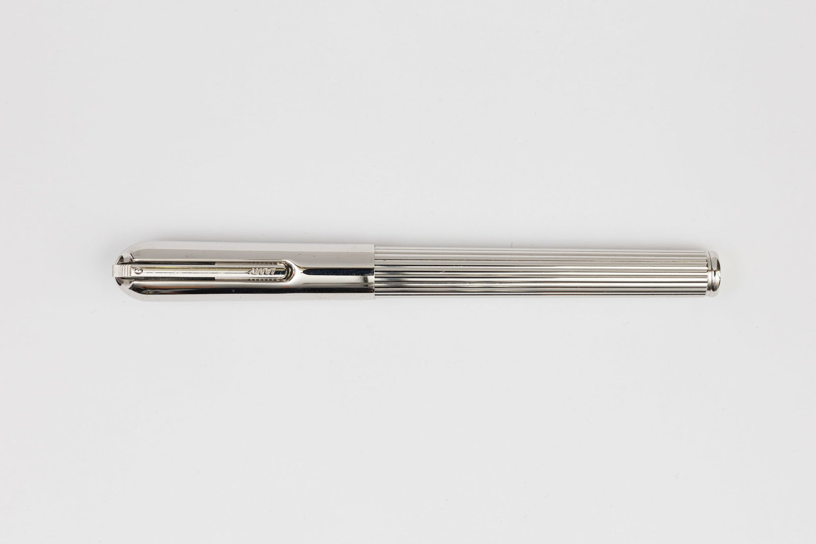 Lamy Persona Platinum Plate Fountain Pen: Lamy Persona platinum finish fountain pen. The Persona was made in several finishes, this the bright platinum finish is the least common of the series. This model with retracted pivoting clip and Lamy
