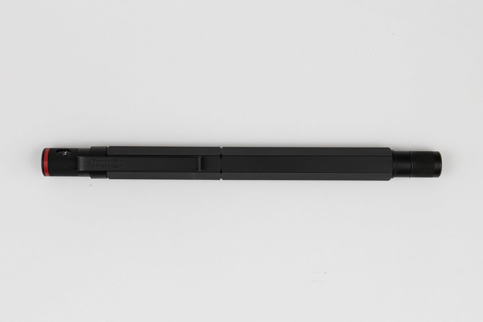 Rotring 600 Black Fountain Pen, Knurled Ends: Rotring 600 black fountain pen. Rotring 600 pens were designed for architects with a hexagon barrel as to not roll of a table. Machined out of solid brass for ample weight, these early Rotrings are cl