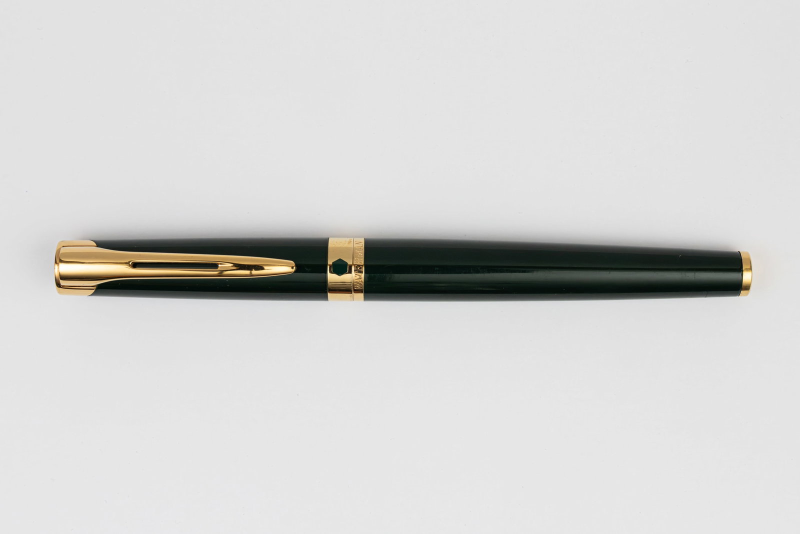 Waterman Etalon Forest Green Fountain Pen, OF 18K Nib: Waterman Etalon green lacquer fountain pen. L’Etalon fountain pen in green lacquer with gold trim and 18K oblique fine nib. Length 5 1/2” and 5 7/8” posted, filling mechanism cartridge/c