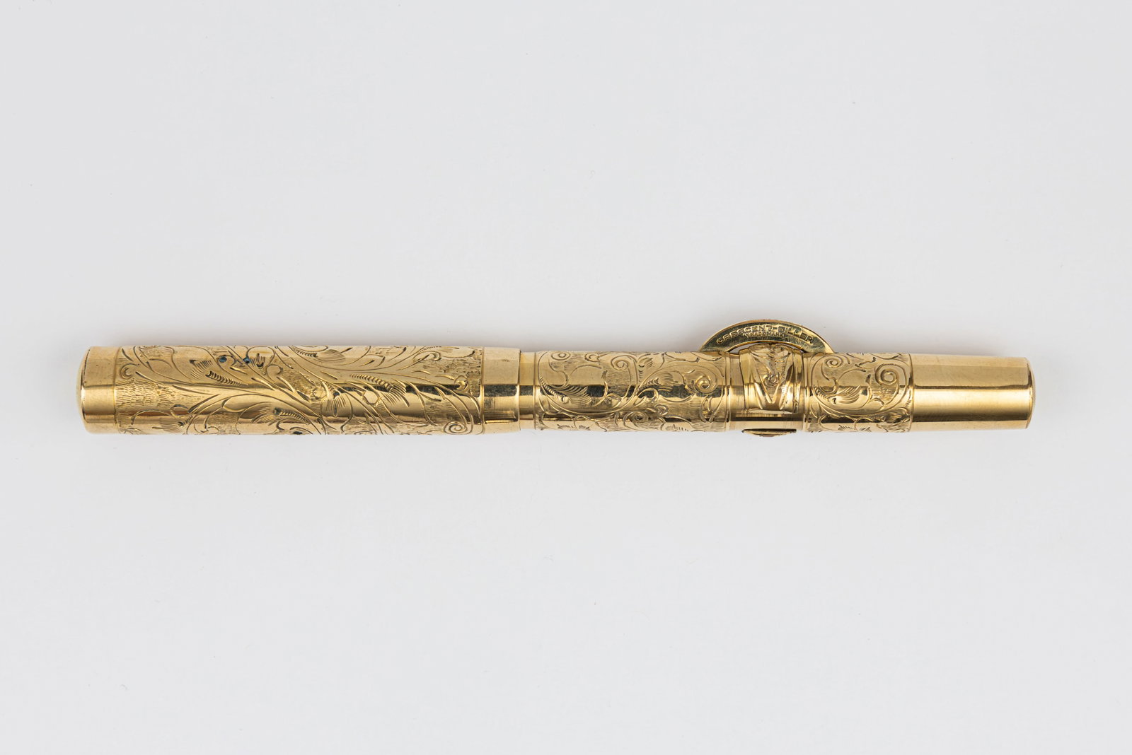 Conklin Crescent Filler Hand Engraved Gold Filled Overlay Fountain Pen: Conklin Crescent Filler Hand Engraved Pansy gold filled overlay fountain pen, circa 1910. Early slip cap Conklin Crescent Filler fountain pen in Hand Engraved with pansy flowers and vines in gold fill