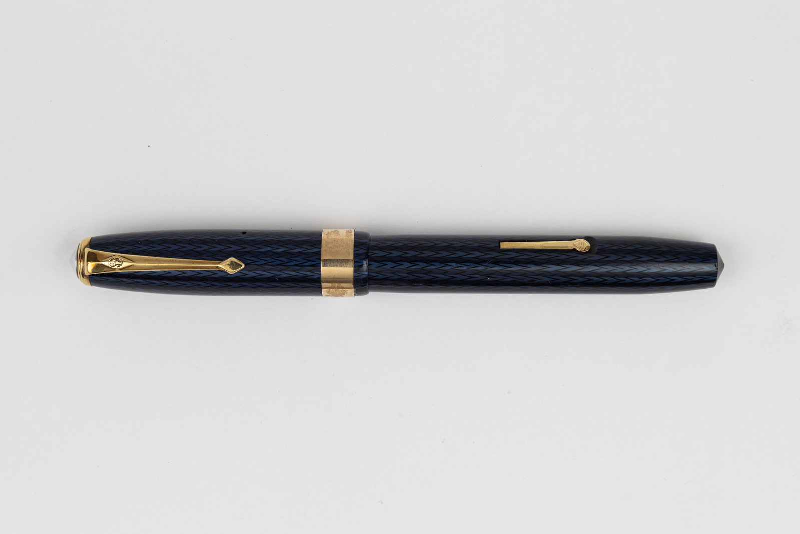 Conway Stewart 60 Blue Herringbone Fountain Pen: Conway Stewart 60 blue herringbone fountain pen, 1950-60. Bright blue and black herringbone pattern with wide band and gold filled trim, correct Conway Stewart 60 14K medium nib. Length 5 1/8” a