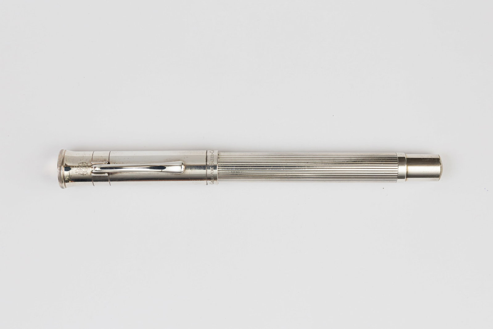 Graf Von Faber-Castell Classic Platinum Plate Fountain Pen: Graf Von Faber-Castell Classic Platinum Plate fountain pen. Faber-Castell Classic fountain pen in Platinum Plate with black guilloche section and two-tone 18K fine nib. Length 5 3/8”, filling me