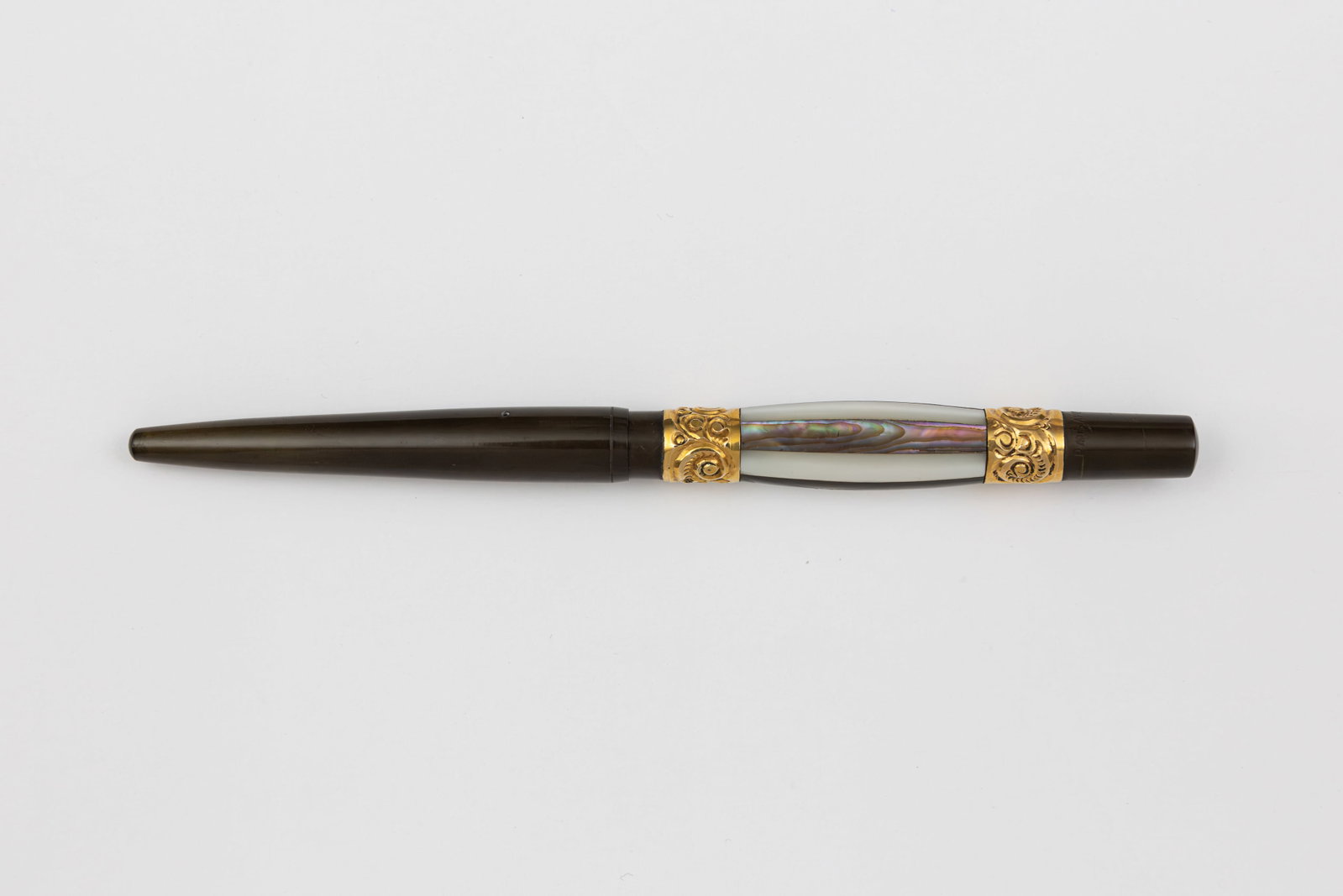 D.W. Beaumel Faceted Alternating Abalone/Mother of Pearl Fountain Pen: D.W. Beaumel faceted alternating abalone and mother of pearl fountain pen, circa 1910’s. Marked near base Pat. Appl’d For, these pens are known as having being made by D.W. Beaumel, with similar a