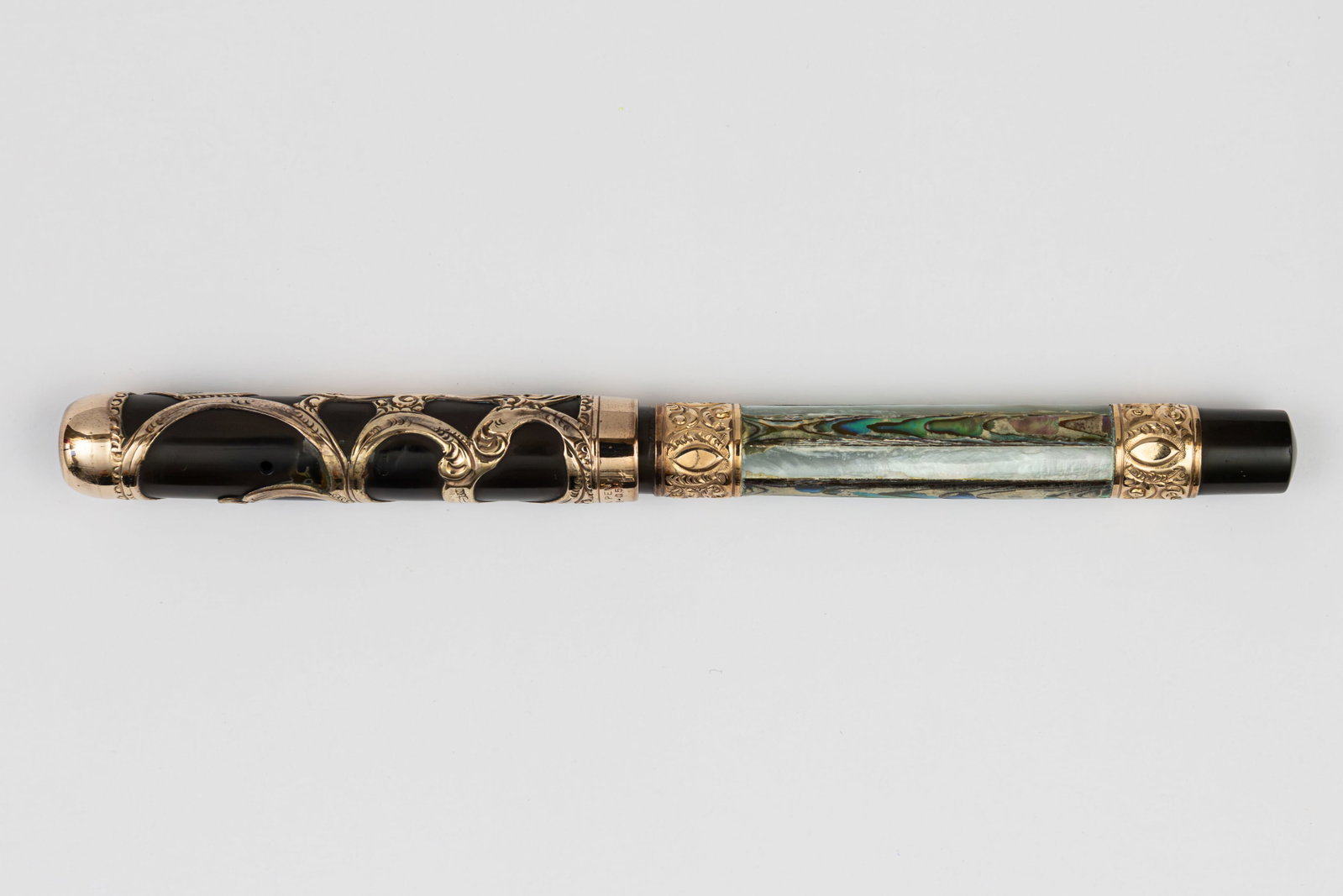 Parker Lucky Curve 15 Alternating Abalone, Pearl Slab, Gold Fountain Pen: Parker Lucky Curve 15 alternating abalone and mother of pearl slab fountain pen, circa 1906-1912. Parker 15 with earlier rounded top, gold filigree cap over black hard rubber with decorative alternati