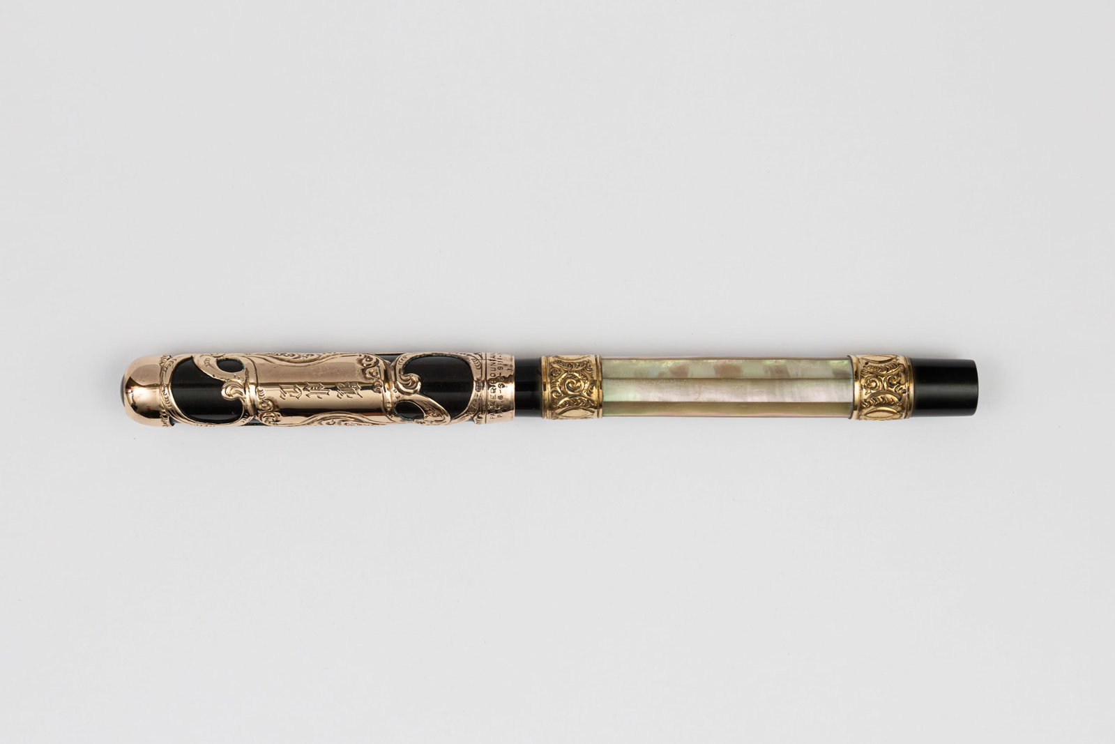 Parker Lucky Curve 15 Pearl Slab Gold Filigree Fountain Pen: Parker Lucky Curve 15 mother of pearl slab fountain pen, circa 1906-1912. Parker 15 with earlier rounded top gold filigree cap over black hard rubber with decorative mother of pearl slabs with gold fi