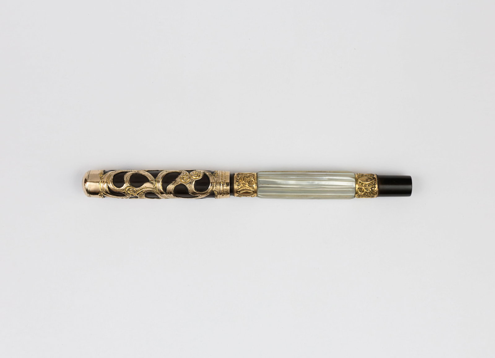 Parker Lucky Curve 15 Fluted Pearl Slab Gold Filigree Fountain Pen: Parker Lucky Curve 15 fluted pearl slab fountain pen, circa 1906-1912. Parker 15 with earlier rounded top gold filigree cap over black hard rubber, decorative fluted mother of pearl barrel with gold f