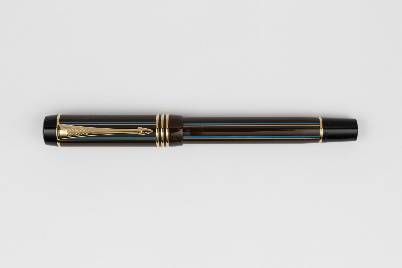 Parker Duofold International Chocolate Pinstripe SE Fountain Pen, Boxed: Parker Duofold International Chocolate Pinstripe special edition fountain pen, with box, outer box and papers, circa 2004. The Duofold reappeared in a new form in 1987, incorporating some of the styli