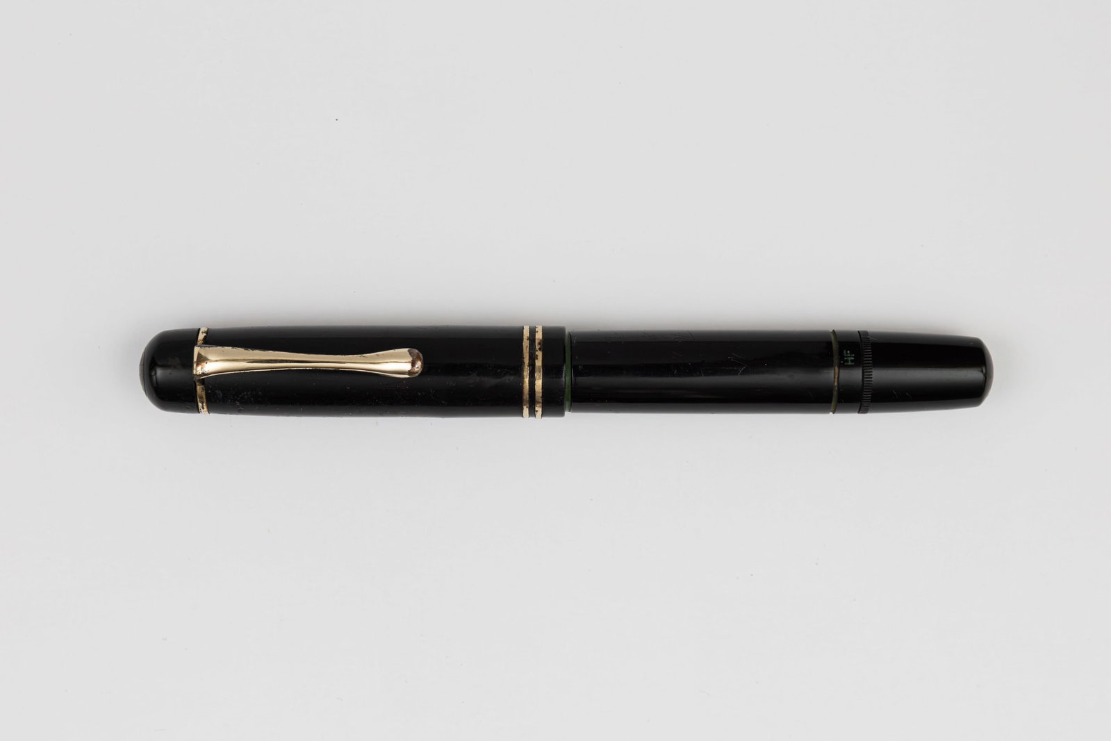 Pelikan 100N Black Short Top Cap Model Fountain Pen: Pelikan 100N black short top cap fountain pen, circa 1937-39. Pelikan 100N in black with uncommon short top cap, marked HF on barrel with correct Pelikan 14K hard fine nib. Length 4 3/4” and 6 1