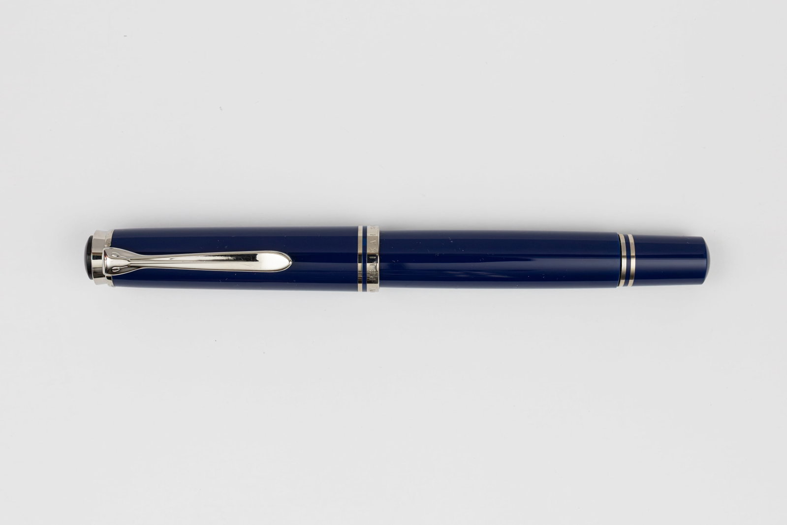Pelikan M805 Dark Blue Fountain Pen, Boxed, BB Nib: Pelikan M805 Dark Blue fountain pen, with box, outer box and papers, circa 2003. Pelikan M805 Dark Blue with silver trim and two-tone 18K double broad nib. Length 5 1/2” and 6 1/2” posted,