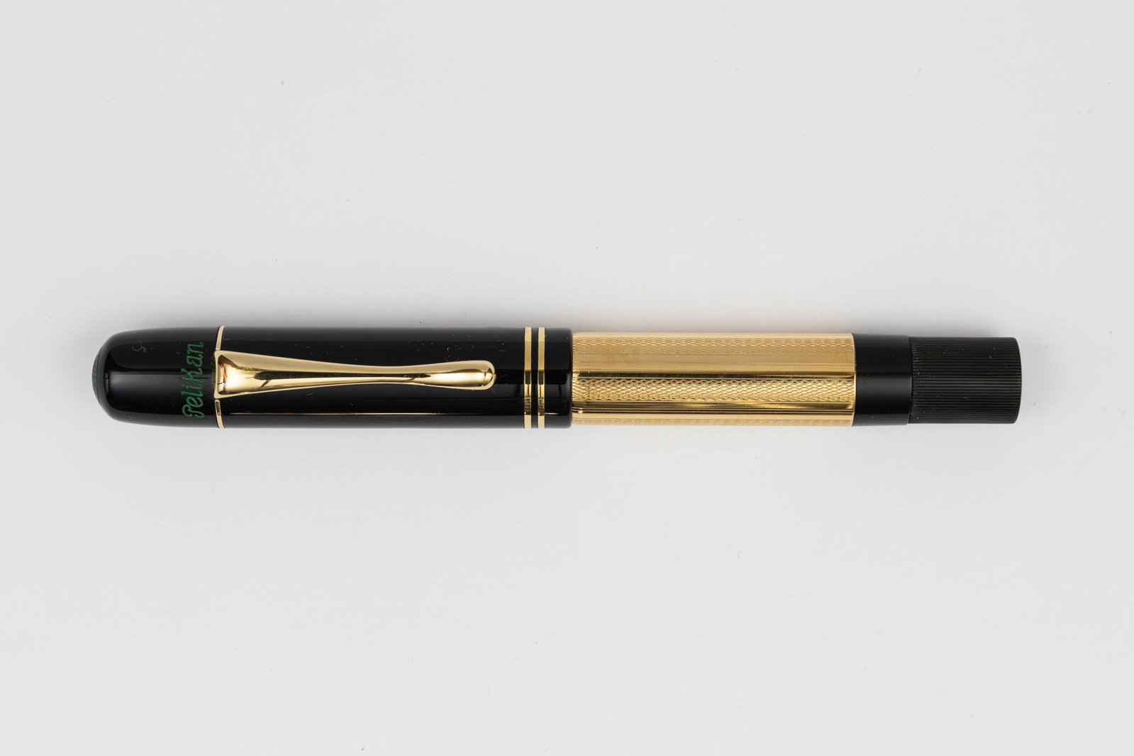 Pelikan Originals of Their Time 1931 18K Solid Gold Overlay Fountain Pen: 1997 Pelikan Originals of Their Time 1931 Gold limited edition fountain pen with box, outer box and papers. The Pelikan Originals of Their Time series includes five models, this is the 18K solid gold 