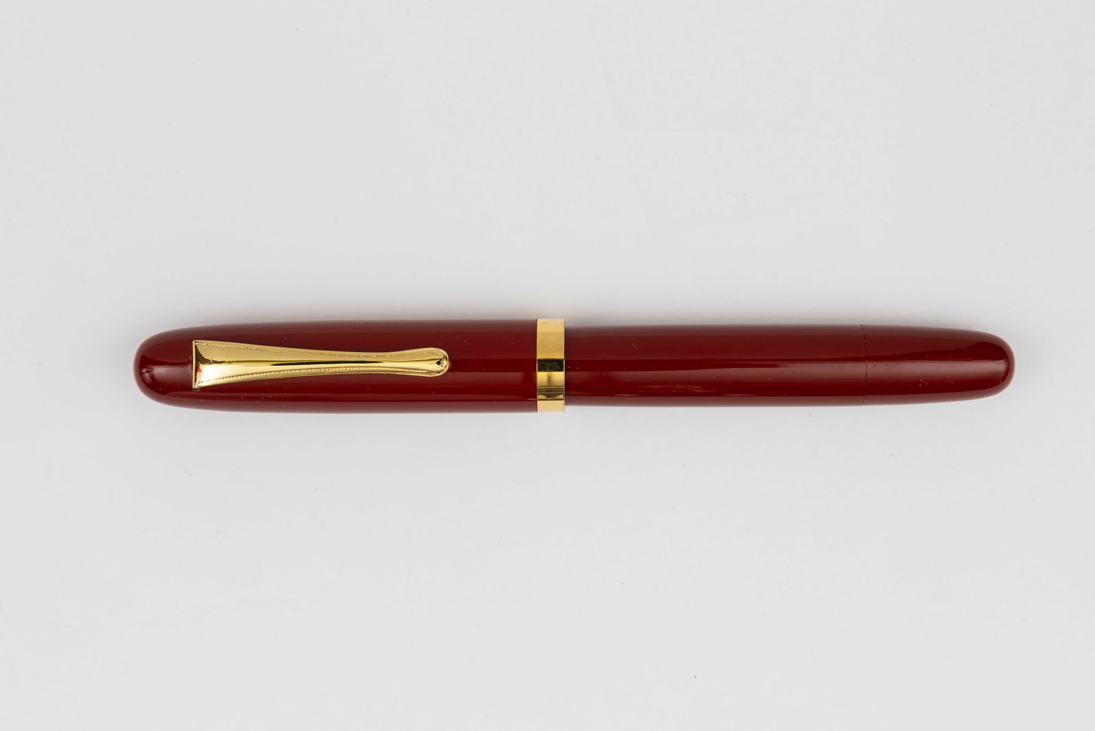 Ban-ei Balance Red Urushi Lacquer Fountain Pen: Ban-ei Balance red urushi lacquer fountain pen, circa 1980’s-90’s. Standard size with red urushi lacquer over hard rubber, not marked but in the Ban-ei shape with nib marked in Japanese text (fukk