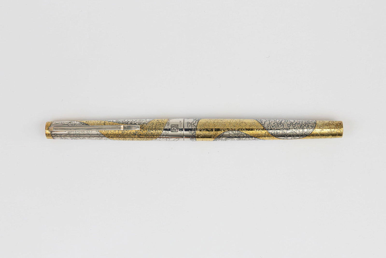 Platinum Riviere Ginga Galaxy Etched Sterling Silver, Gold Fountain Pen: Platinum Riviere Ginga Galaxy etched sterling silver and gold fountain pen, circa 1970’s Platinum Riviere Ginga in Galaxy pattern with etched design in silver and gold, marked sterling silver on cap