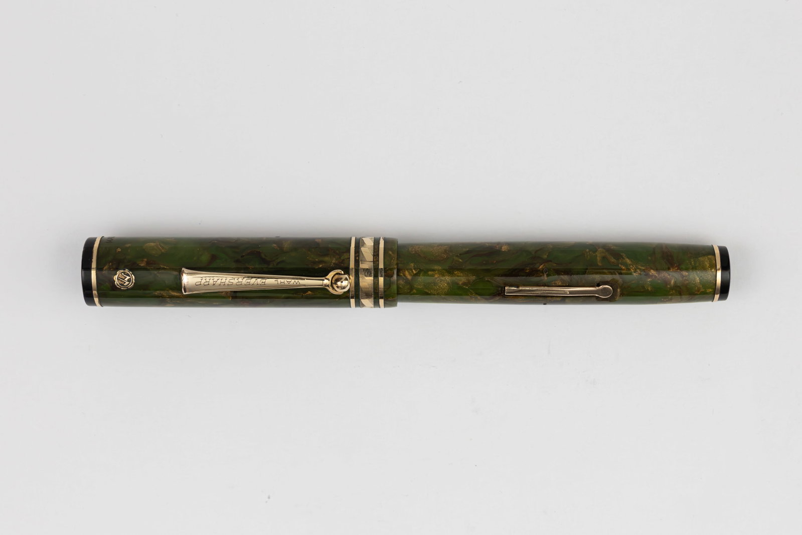 Wahl Eversharp Oversized Brazilian Green Fountain Pen: Wahl Eversharp oversized rhomboid band Brazilian Green fountain pen, circa 1929. Gold Seal oversized rhomboid cap band pen with Wahl Eversharp Gold Seal flexible 14K medium tip. Length 5 3/8” an
