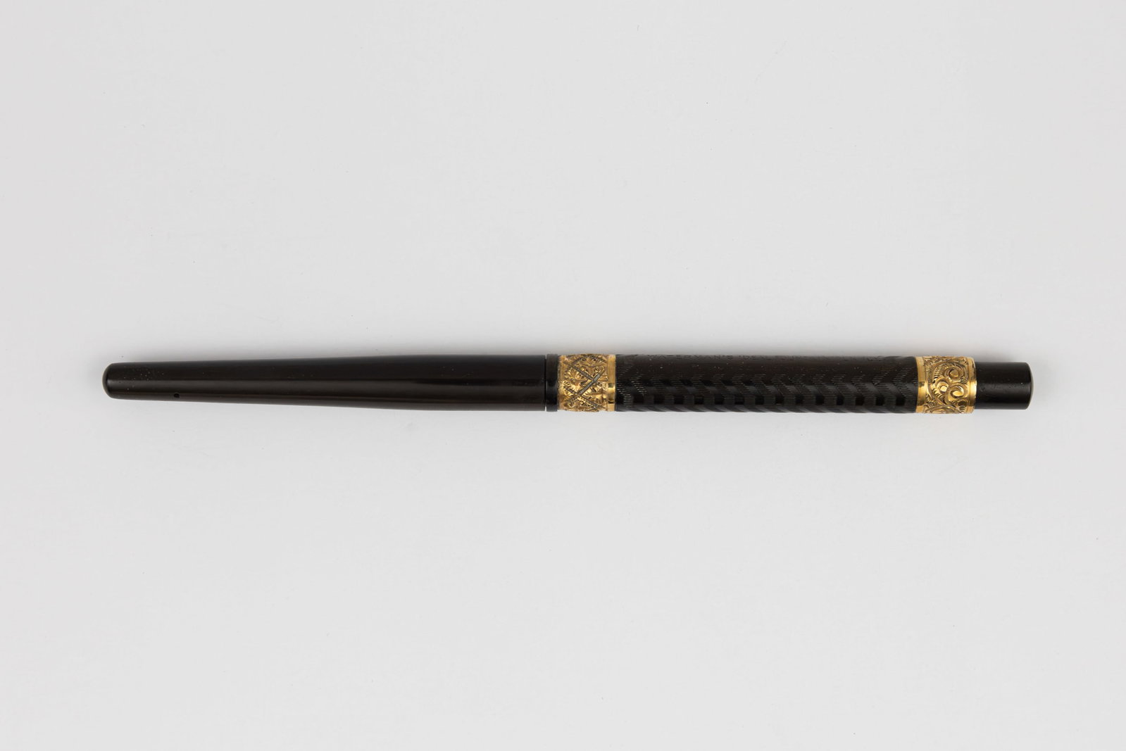 Waterman 24 Taper Cap Black Chased Hard Rubber Fountain Pen: Waterman 24 taper cap black chased hard rubber fountain pen gold filled chased bands, circa 1900. Waterman 24 taper cap fountain pen with wide gold filled chased bands in black chased hard rubber in e