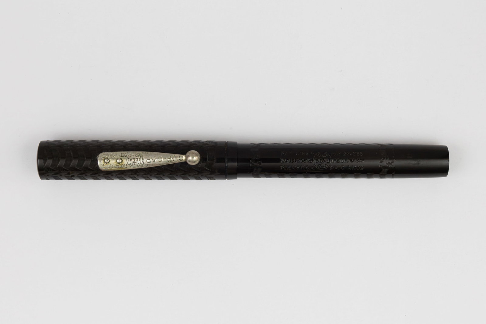 Waterman 16 Black Chased Hard Rubber Fountain Pen: Waterman 16 black chased hard rubber fountain pen, circa 1905-1910. Large Waterman Ideal 16 with deep imprints and chasing, nickel trim and Waterman Ideal New York 6 14K broad flexible nib. Length 5 3
