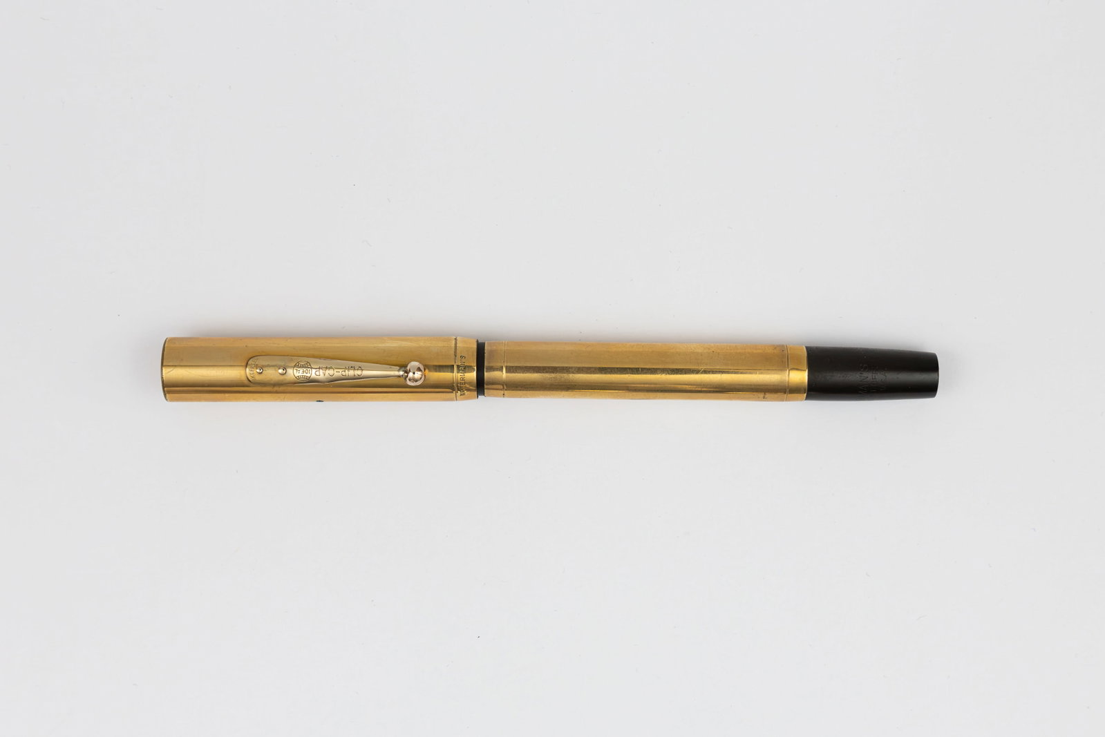 Waterman 0552 1/2 Smooth Gold Filled Overlay Fountain Pen: Waterman Ideal 0552 1/2 gold filled overlay fountain pen, circa 1920’s. Gold filled overlay in smooth pattern Waterman with Waterman Ideal 14K fine flexible nib. Length 5 1/4” and 6 3/4”