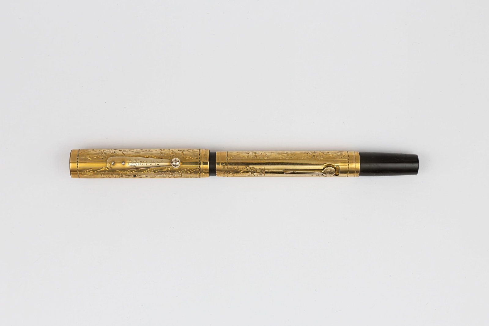 Waterman 0552 1/2 Pansy Panel Gold Filled Overlay Fountain Pen: Waterman Ideal 0552 1/2 Pansy Panel gold filled overlay fountain pen, circa 1920’s. Gold filled overlay in Pansy Panel pattern Waterman with Waterman Ideal 14K fine flexible nib. Length 5 1/4”