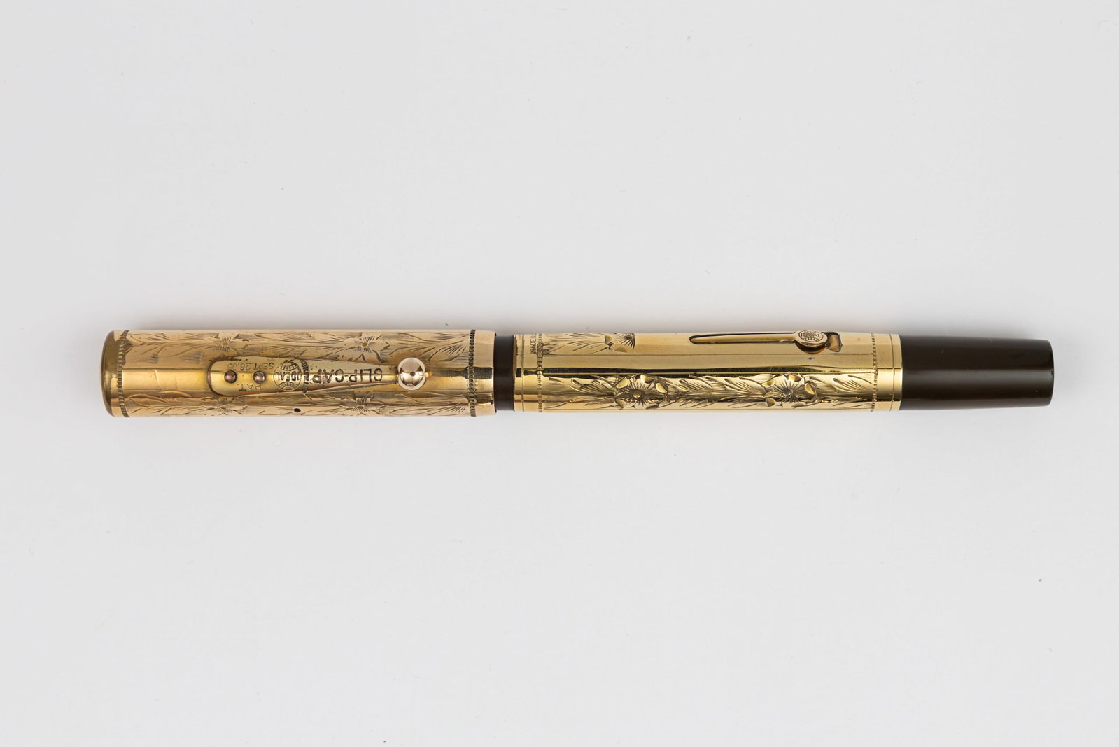 Waterman 0552 Pansy Gold Filled Overlay Fountain Pen: Waterman Ideal 0552 Pansy Panel gold filled overlay fountain pen, circa 1920’s. Gold filled overlay in Pansy Panel pattern Waterman with Waterman Ideal 14K broad flexible nib. Length 5 3/8” an