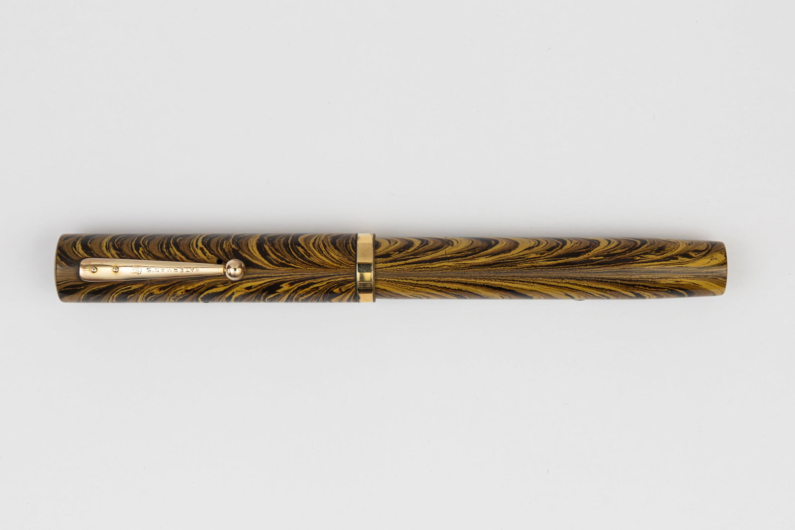 Waterman 94 Olive Ripple Fountain Pen: Waterman Ideal 94 Olive Ripple fountain pen, circa 1928. The Olive Ripple was one of three later coloured Ripple models that Waterman introduced to compete with the marbled celluloid pens from the thr