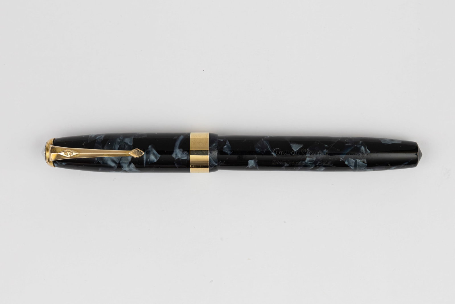 Conway Stewart 60 Executive Blue/Black Marble Fountain Pen: Conway Stewart 60 Executive blue/black fountain pen, 1950-60. Blue and black marble with wide band and gold filled trim, Conway Stewart Duro 14K fine nib. Length 5 1/8” and 6 1/8” posted, 
