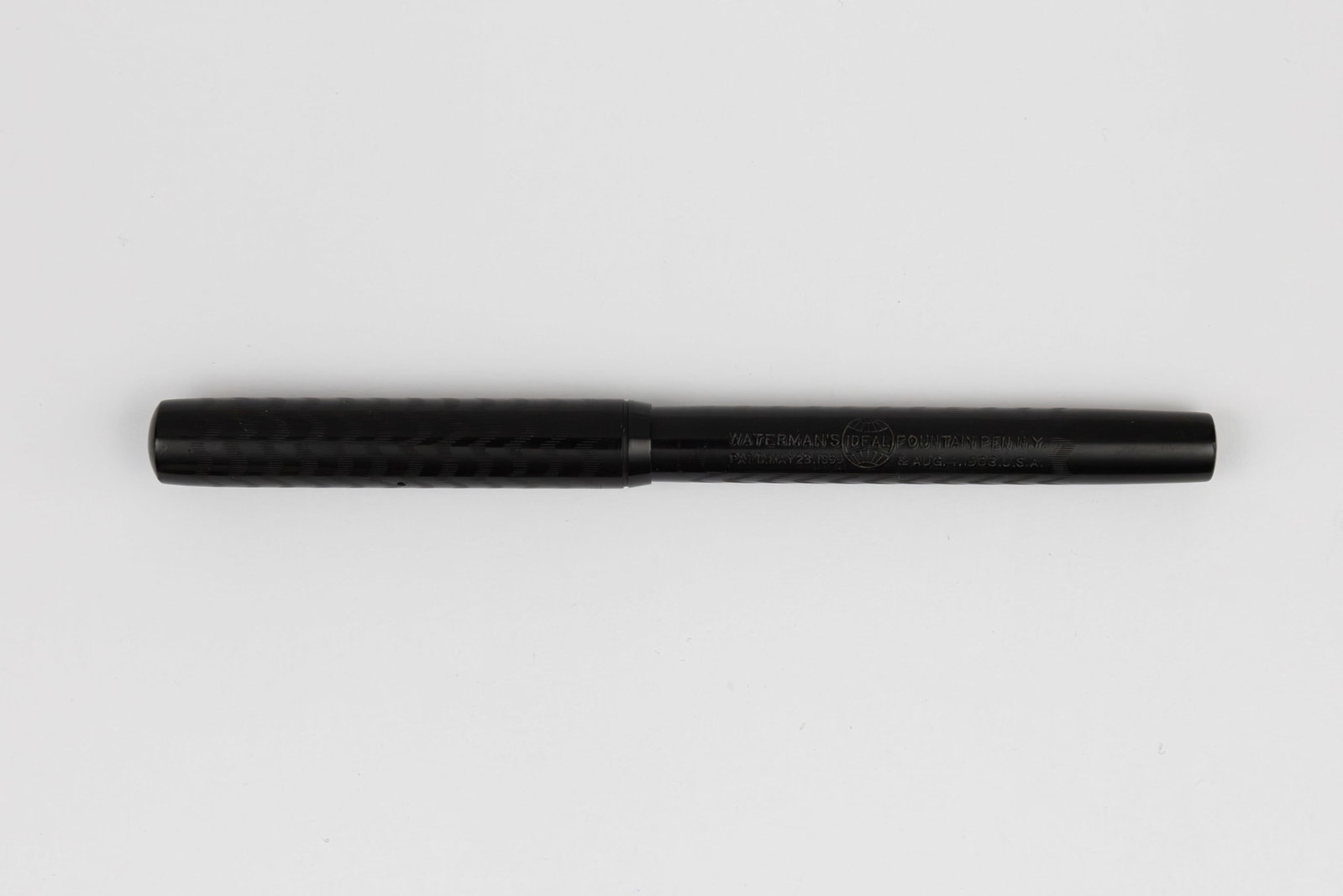 Waterman Ideal 14 Black Chased Hard Rubber Fountain Pen: Waterman Ideal 14 black chased hard rubber fountain pen, circa 1910. Waterman 14 black chased hard rubber fountain pen with Waterman Ideal New York 4 14K medium stub flexible nib. Length 5 1/4” 