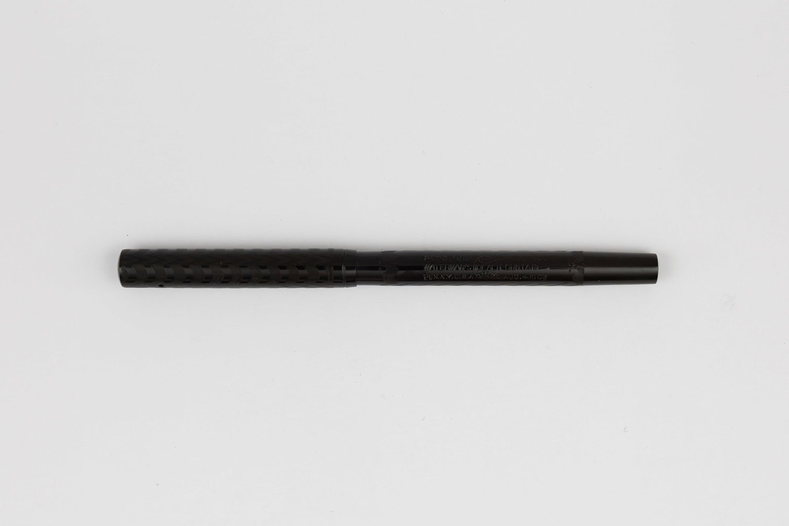 Waterman Ideal 12 1/2 Black Chased Hard Rubber Fountain Pen: Waterman Ideal 12 1/2 black chased hard rubber fountain pen, circa 1910. Waterman 12 1/2 black chased hard rubber fountain pen with Waterman Ideal New York 2 14K fine flexible nib. Length 4 3/4 and 6 
