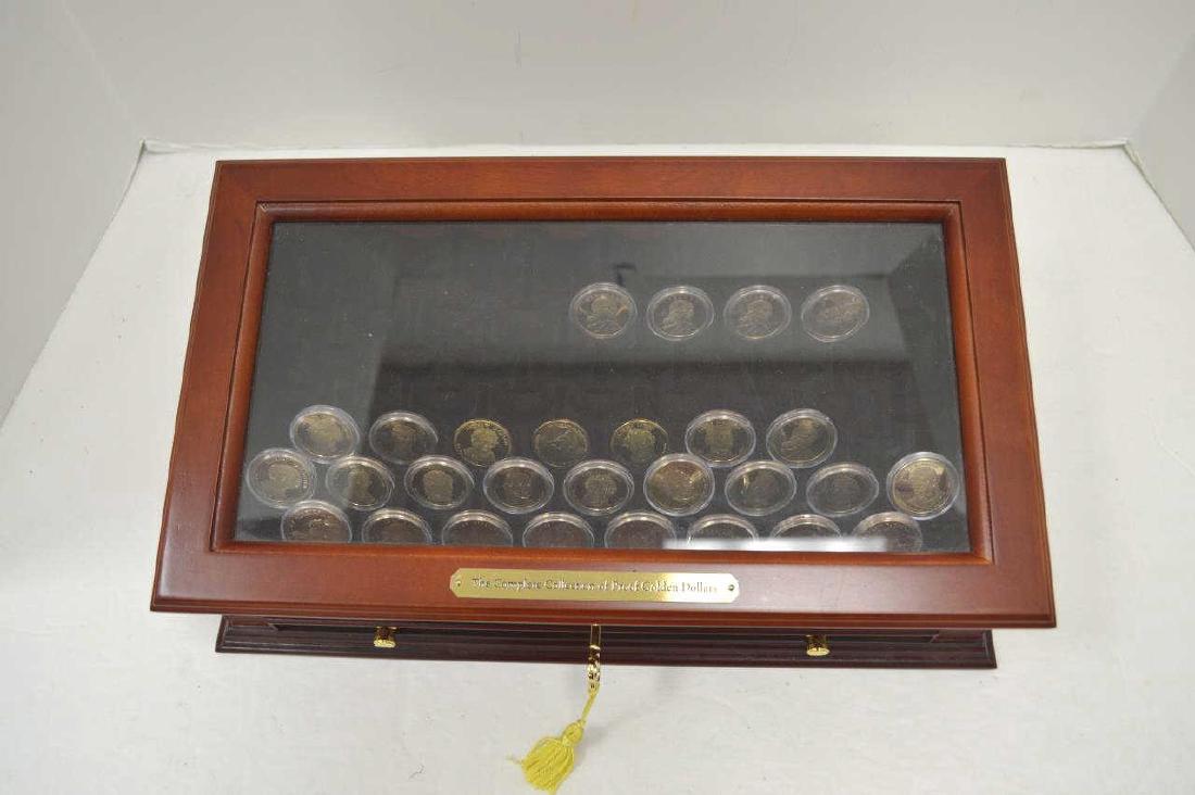 Collection of Golden Dollars: Collection of golden dollars- Great Gift. 28 Gold Dollars in Proof Condition in beautiful wood presentation box.