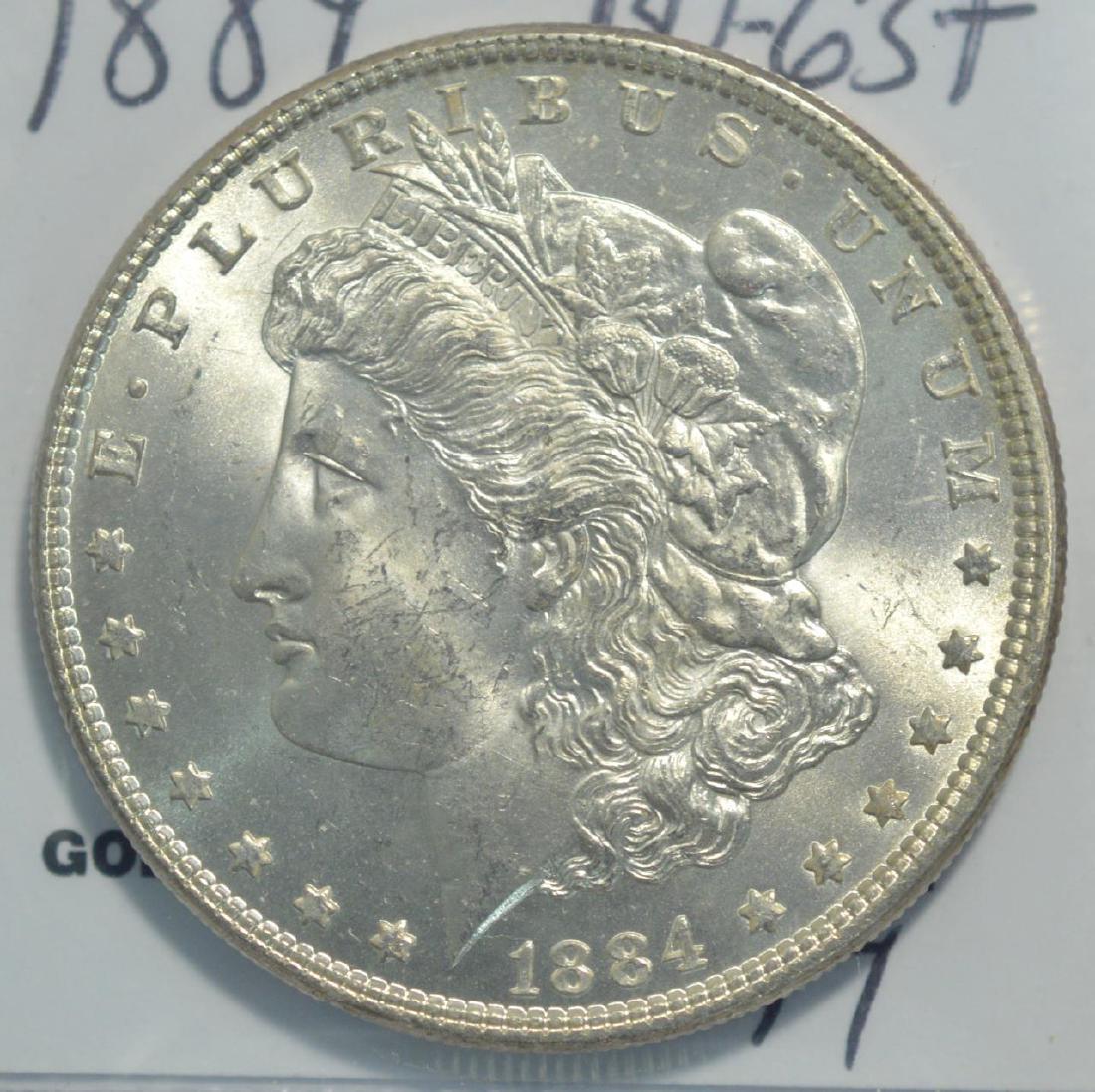 1884 Morgan Silver Dollar BU-63+ White (1 of 3)