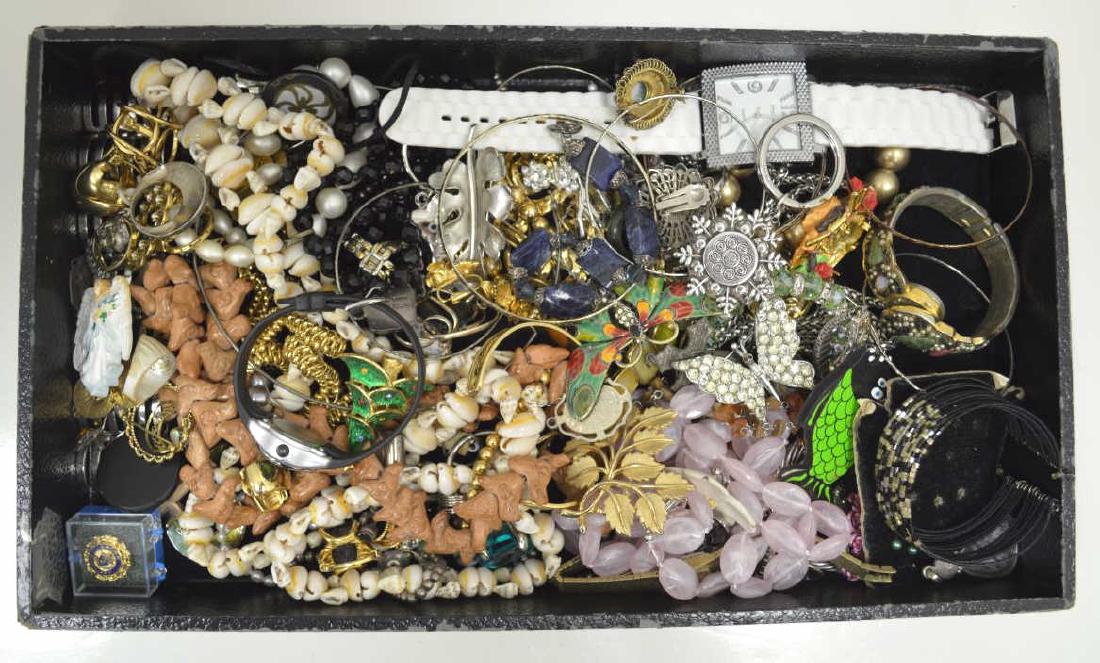 Lot of costume jewelry: Lot of costume jewelry including, beaded necklace, large leaf pins, cuff bracelets, various ladies watches, and many pairs of clip on earrings.