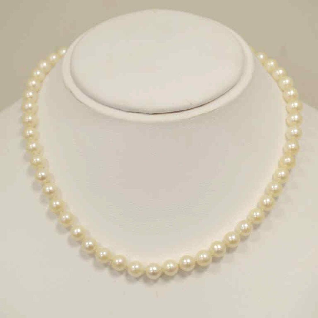16" strand of fresh water pearls: Ladies 16" strand of freshwater pearls featuring pearls featuring single knotted 7mm creamy white color pearls. Finished with a 14kt white gold pearl clasp.
