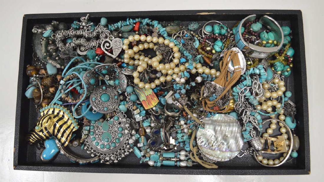 Large lot of costume jewelry: Large lot of costume jewelry including turquoise stone bead necklaces, large zebra pin, fancy link bracelets, large stone pendants, earrings and more.