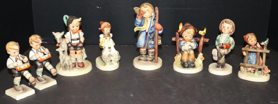 8 Hummels: 240, 200, 47, 150, 174, 109 & 203: 8 Hummels: 2 Little Drummers (#240), Little Goat Herder (#200/I), Goose Girl (#47 3/0), Hear Ye, Hear Ye Boy Blowing Horn (#15/0), She Loves Me..She Loves Me Not (#174), Happy Traveler (#109/0) & Sign