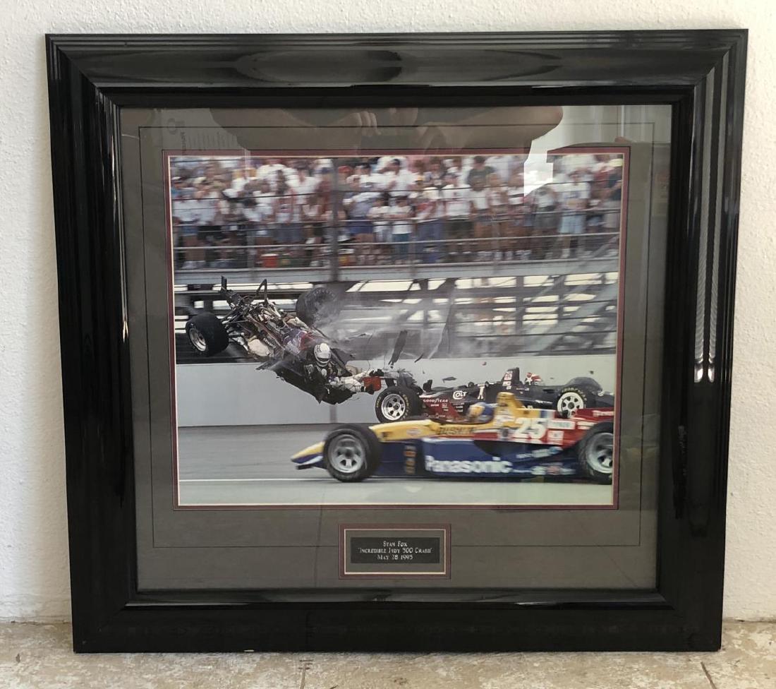 Stan Fox INDY CRASH 1995 Framed Action Photo: Stan Fox INDY CRASH 1995 Framed Action Photograph. This photograph captures the moment Stan Fox's Indy car broke apart mid-air and surviving the horrendous crash. Overall size is 29.5" x 27.75", doubl