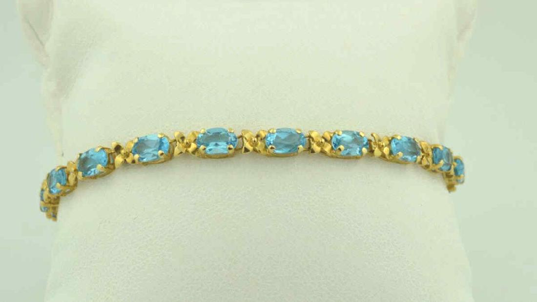 14kt y/g Blue Topaz Bracelet With Floral Links (1 of 3)