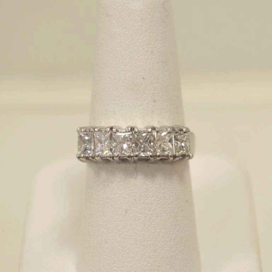 Platinum and diamond wedding band: Ladies platinum diamond wedding band featuring six prong set princess cut diamonds weighing approx. 2.40ct, Clarity VS2- SI1, Color H-I. Finger size 6 3/4. Weight 8.6 grams