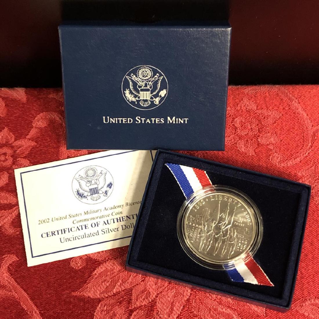 2002 West Point Academy Commem Silver UNC $1: 2002 West Point Academy Commem Silver UNC $11. Accompanied with its original box & COA.