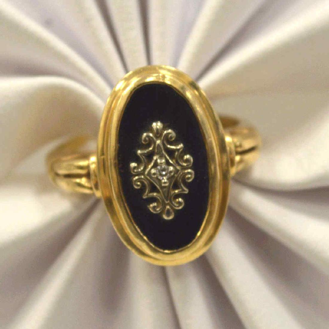 Lady's 14kt yellow gold oval onyx ring (1 of 4)