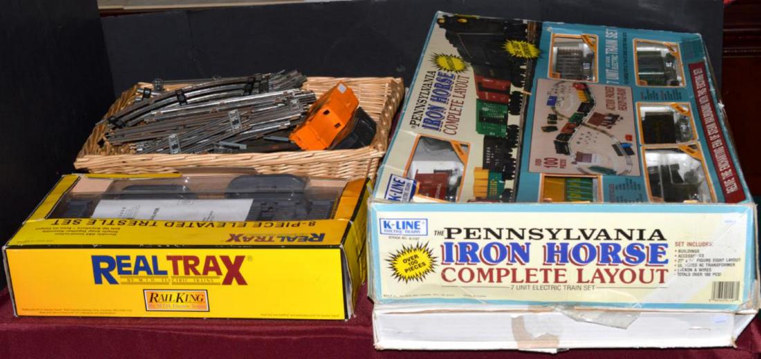 Model Toy Train O Gauge Engines Cars Track: Model Toy Train O Gauge Engines Cars Track. K-line Electric Train Set. The Pennsylvania Iron Horse Complete Layout in box. Real Trax 8-Piece Elevated Trestle System in box. Box & basket of extra track