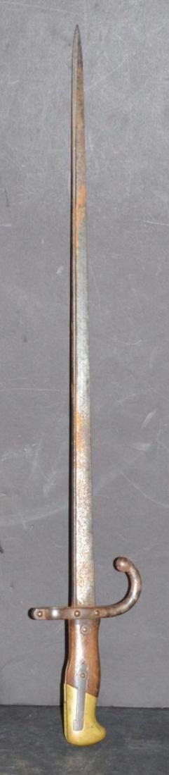1875 French Gras Rifle Bayonet Original Finish: 1875 French Gras Rifle Bayonet with the Original Finish, designed for the 1874 Gras Rifle. It has a sturdy triangular blade as it was the last of the sword type bayonets and features a quillon sword-b