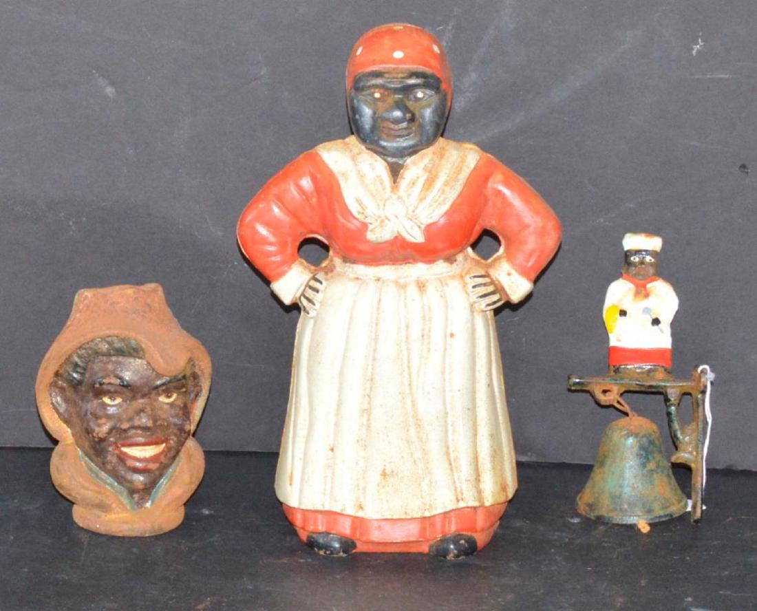 Lot of 3 Black Americana Cast Iron Collectibles: Large Mammy Bank with red dress & head rag with white apron 11" tall. Cast Iron chef bell 6.25" tall. Gentleman with hat cast iron bank. 5.5" tall.