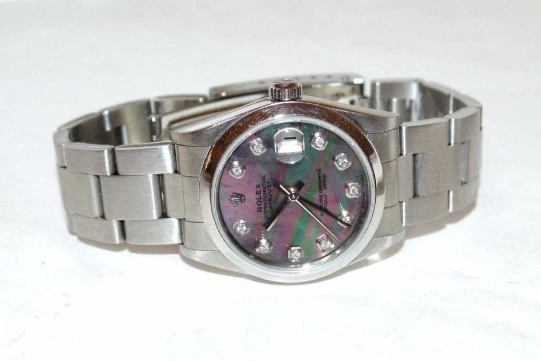 Stainless Mid Size Rolex Watch: Stainless mid size Rolex watch with mother of pearl diamond dial, smooth engine tuned bezel, sapphire crystal, water resistant and oyster band. 01