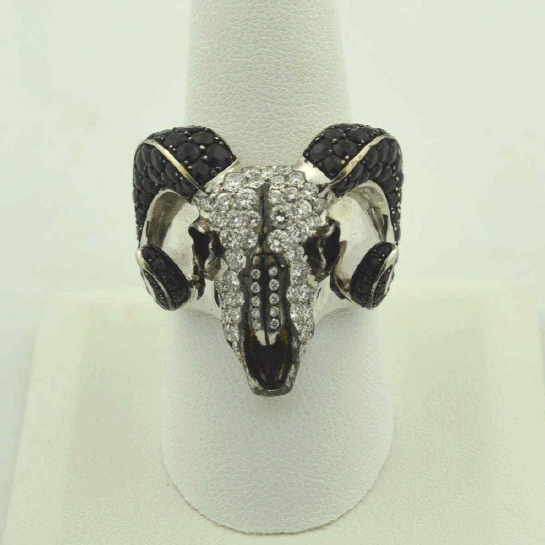 18kt diamond ram skull ring by Stephen Webster: 18kt white gold black and white diamond ram skull ring by London designer Stephen Webster featuring prong set round black diamond on the horns weighing approx. 3.50ct and round brilliant cut white dia
